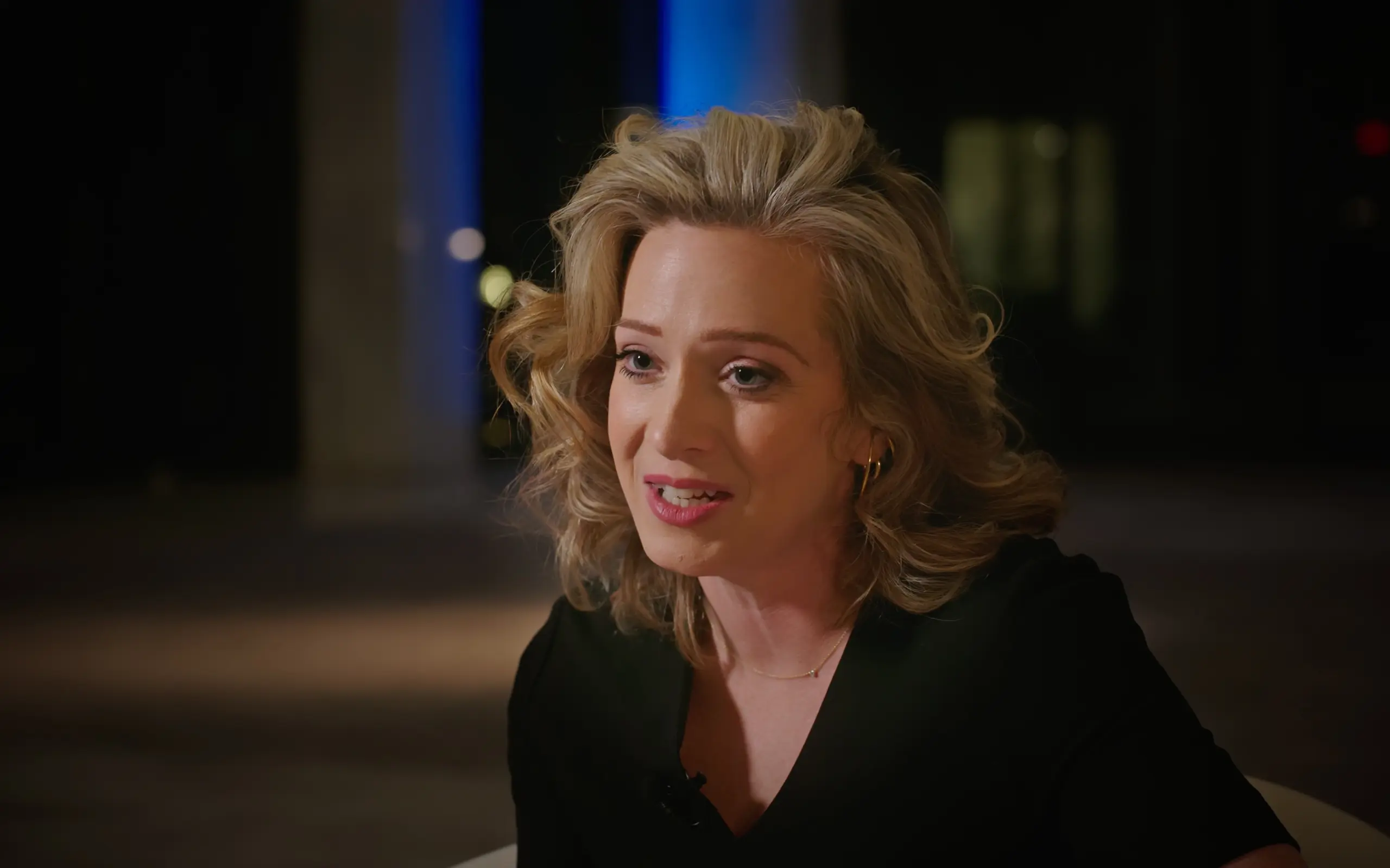 Broadcast journalist on a night set